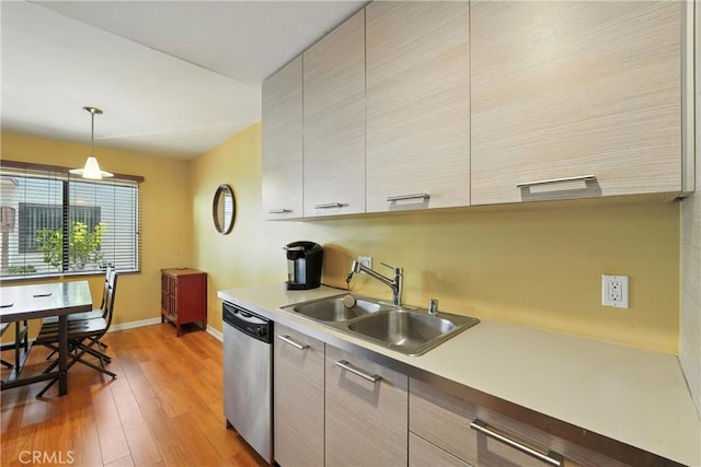 6250 Fulton Ave Unit 104, Van Nuys, CA 91401 - kitchen featuring dishwasher, light wood-style floors, light countertops, and modern cabinets