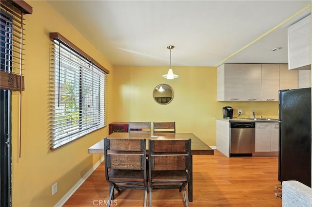 6250 Fulton Ave Unit 104, Van Nuys, CA 91401 - dining room featuring light wood finished floors