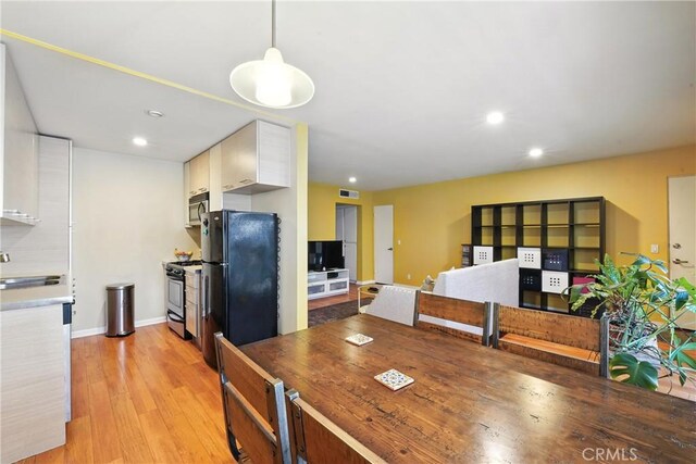 6250 Fulton Ave Unit 104, Van Nuys, CA 91401 - dining room with light wood-style floors and recessed lighting