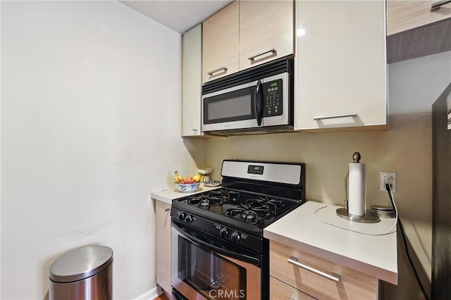 6250 Fulton Ave Unit 104, Van Nuys, CA 91401 - kitchen with appliances with stainless steel finishes and light countertops
