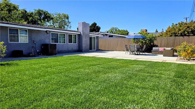 2108 Raleigh Ave, Costa Mesa, CA 92627 - rear view of house featuring stucco siding, a patio, a chimney, and an outdoor living space