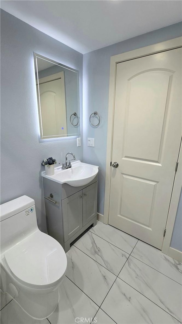2108 Raleigh Ave, Costa Mesa, CA 92627 - half bath featuring vanity and marble look tiles