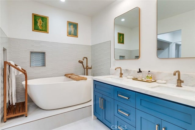 2501 S El Camino Real Unit 310, San Clemente, CA 92672 - full bath featuring double vanity, a freestanding bath, and tile walls