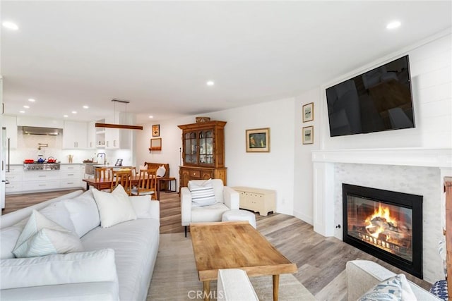 2501 S El Camino Real Unit 310, San Clemente, CA 92672 - living area with recessed lighting, light wood-style flooring, and a glass covered fireplace