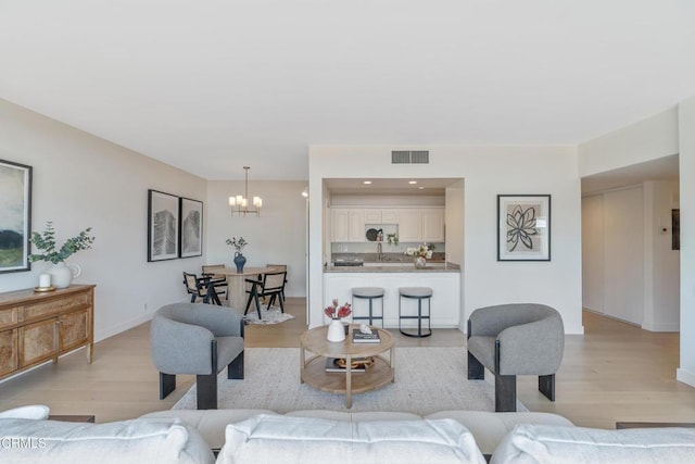960 San Pasqual St Unit 208, Pasadena, CA 91106 - living room featuring light wood-type flooring, a chandelier, and recessed lighting