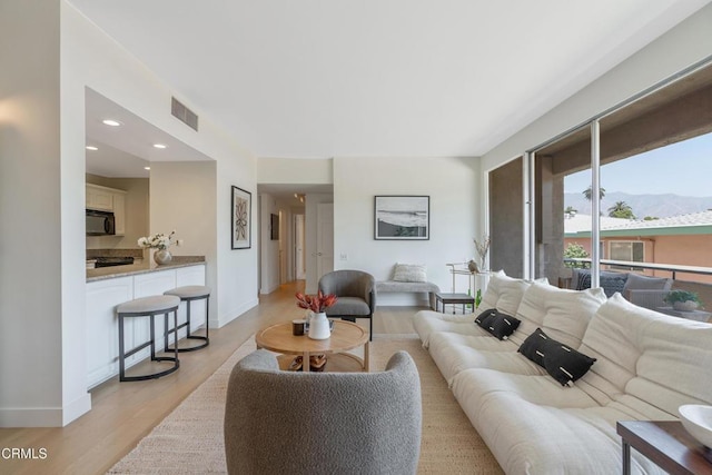 960 San Pasqual St Unit 208, Pasadena, CA 91106 - living room featuring light wood-type flooring, a mountain view, and recessed lighting