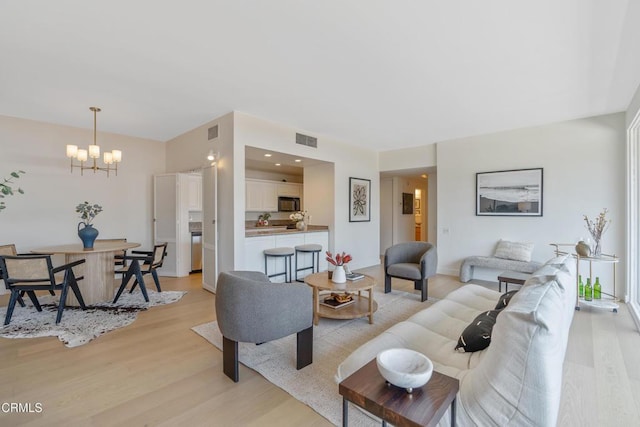 960 San Pasqual St Unit 208, Pasadena, CA 91106 - living room featuring light wood-style floors and a chandelier