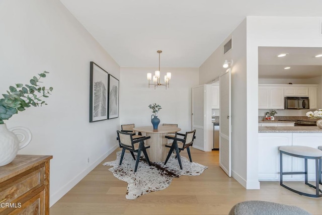 960 San Pasqual St Unit 208, Pasadena, CA 91106 - dining space with light wood finished floors, a chandelier, and recessed lighting