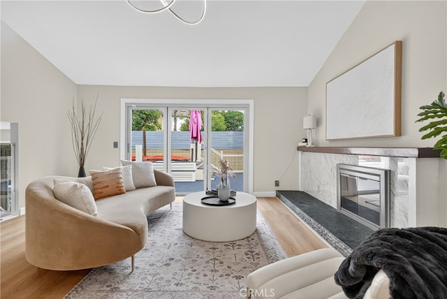913 Lindencliff St, Torrance, CA 90502 - living area with wood finished floors, vaulted ceiling, and a premium fireplace