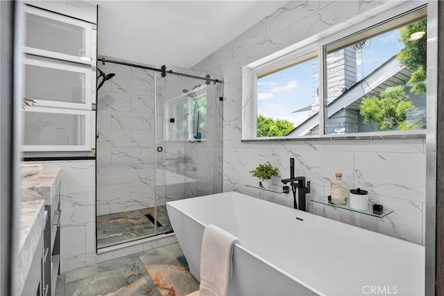913 Lindencliff St, Torrance, CA 90502 - bathroom with a soaking tub, a marble finish shower, marble finish flooring, and tile walls