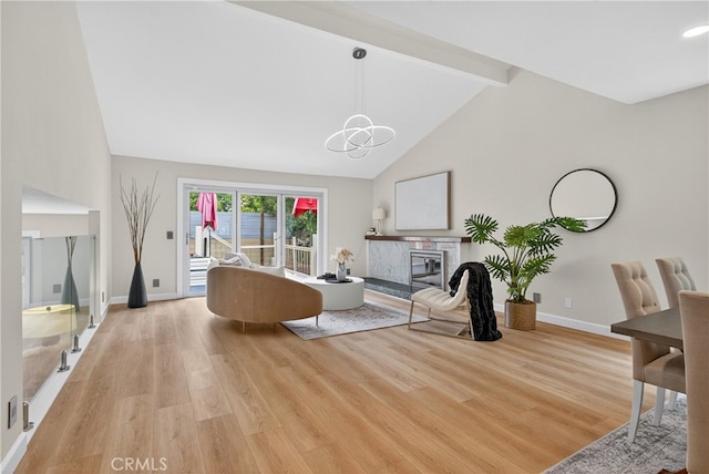 913 Lindencliff St, Torrance, CA 90502 - living area featuring beam ceiling, light wood-style floors, high vaulted ceiling, a chandelier, and a high end fireplace