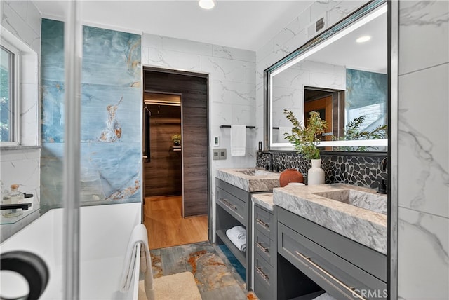 913 Lindencliff St, Torrance, CA 90502 - bathroom featuring vanity, a freestanding tub, and recessed lighting