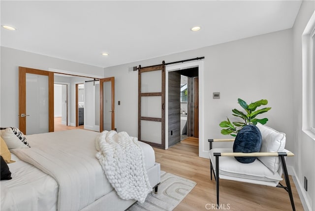913 Lindencliff St, Torrance, CA 90502 - bedroom with a barn door, light wood-style floors, and recessed lighting