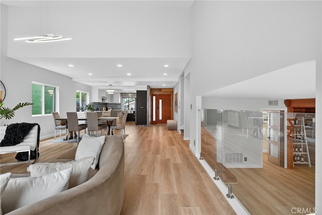 913 Lindencliff St, Torrance, CA 90502 - living area featuring light wood-style flooring, a towering ceiling, and recessed lighting