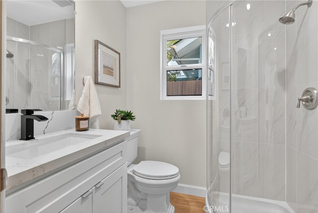 913 Lindencliff St, Torrance, CA 90502 - bathroom featuring vanity, a shower stall, and wood finished floors