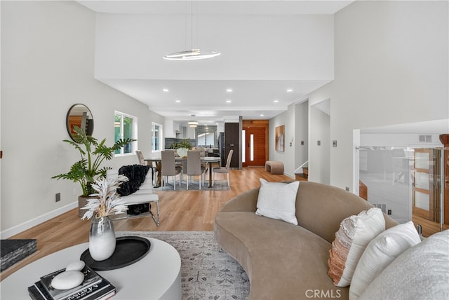 913 Lindencliff St, Torrance, CA 90502 - living area with light wood finished floors, a high ceiling, stairs, and recessed lighting