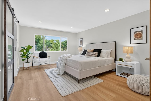 913 Lindencliff St, Torrance, CA 90502 - bedroom with light wood-style floors, a barn door, and recessed lighting