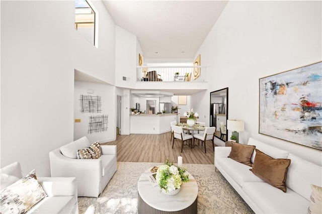 45 Briarglen Unit 64, Irvine, CA 92614 - living room featuring a high ceiling and wood finished floors