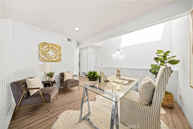 45 Briarglen Unit 64, Irvine, CA 92614 - home office featuring light wood-type flooring, recessed lighting, and a textured ceiling