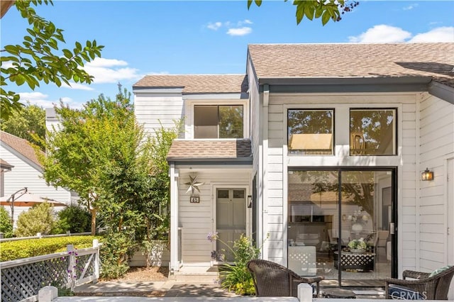 45 Briarglen Unit 64, Irvine, CA 92614 - view of front of house with a shingled roof and a patio