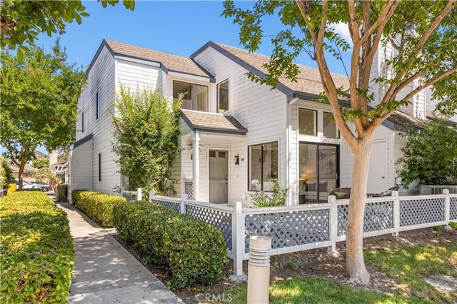 45 Briarglen Unit 64, Irvine, CA 92614 - view of front of house with a shingled roof