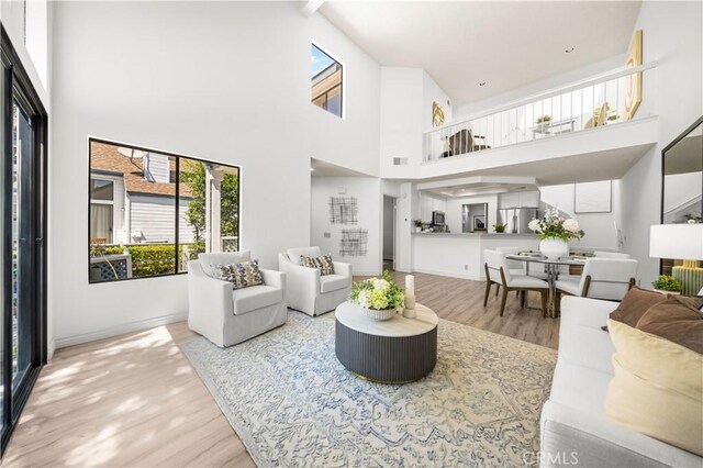 45 Briarglen Unit 64, Irvine, CA 92614 - living area featuring wood finished floors and a high ceiling