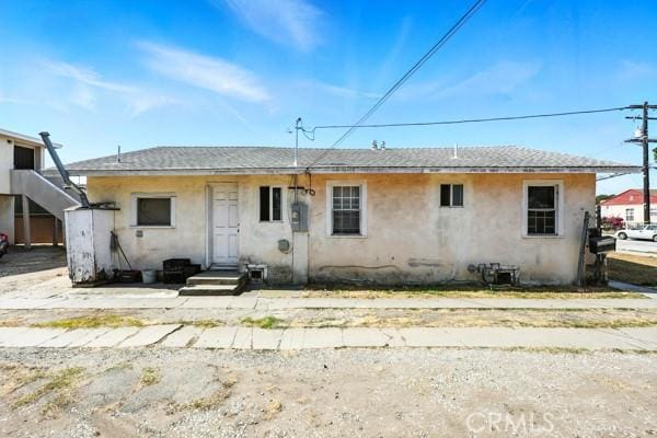 11156 S Grevillea Ave, Hawthorne, CA 90304 - rear view of property with stucco siding and roof with shingles