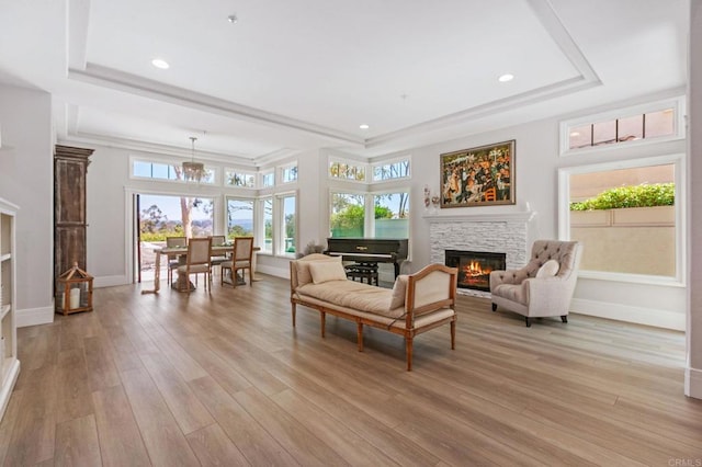 4470 Caminito Tecera, Del Mar, CA 92014 - living room with a stone fireplace, a tray ceiling, plenty of natural light, and recessed lighting