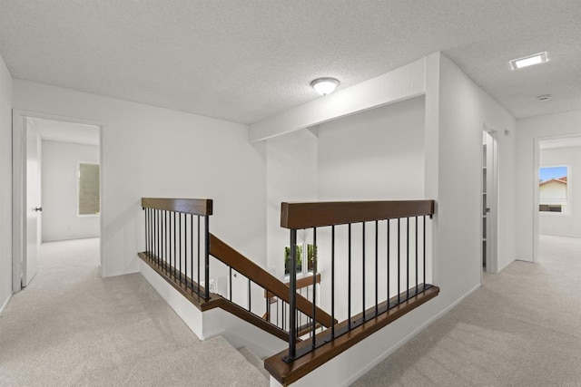13443 Black Hills Rd, San Diego, CA 92129 - hall featuring carpet floors, an upstairs landing, and a textured ceiling