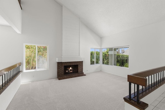 13443 Black Hills Rd, San Diego, CA 92129 - unfurnished living room with high vaulted ceiling, carpet, a fireplace, and a textured ceiling