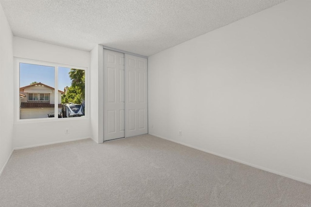 13443 Black Hills Rd, San Diego, CA 92129 - unfurnished bedroom with carpet, a textured ceiling, and a closet