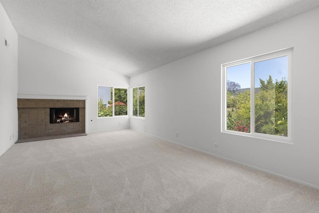 13443 Black Hills Rd, San Diego, CA 92129 - unfurnished living room with carpet, a fireplace, a textured ceiling, and lofted ceiling