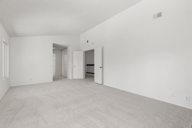 13443 Black Hills Rd, San Diego, CA 92129 - empty room with light carpet and vaulted ceiling