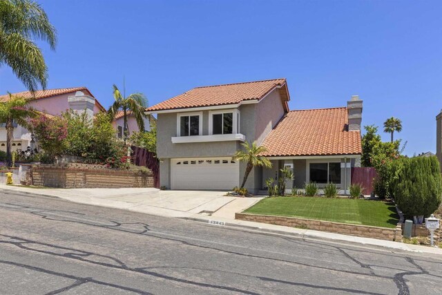 13443 Black Hills Rd, San Diego, CA 92129 - view of front facade with stucco siding, an attached garage, a tiled roof, driveway, and a chimney