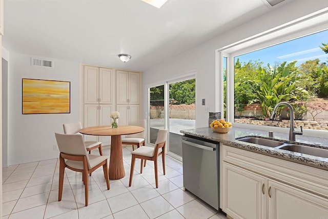 13443 Black Hills Rd, San Diego, CA 92129 - kitchen featuring stainless steel dishwasher, light tile patterned flooring, and stone countertops