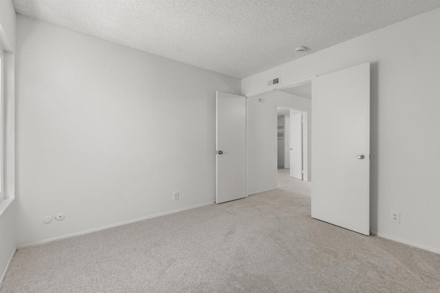 13443 Black Hills Rd, San Diego, CA 92129 - unfurnished bedroom featuring carpet and a textured ceiling
