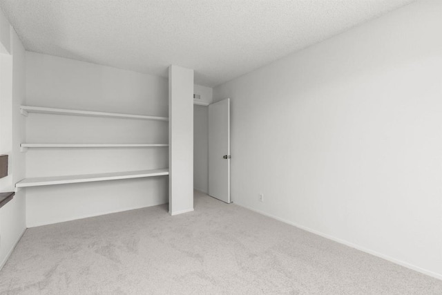 13443 Black Hills Rd, San Diego, CA 92129 - unfurnished bedroom with carpet floors, a textured ceiling, and a closet