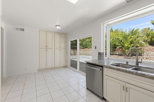 13443 Black Hills Rd, San Diego, CA 92129 - kitchen with dishwasher, light stone counters, and light tile patterned floors