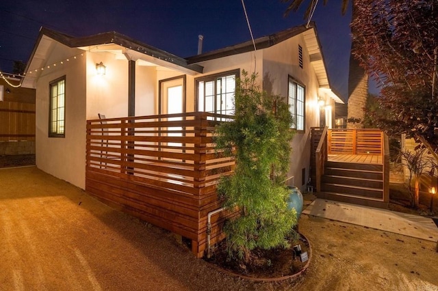 376378 Acacia Dr, Carlsbad, CA 92008 - property exterior at twilight featuring stucco siding and a deck