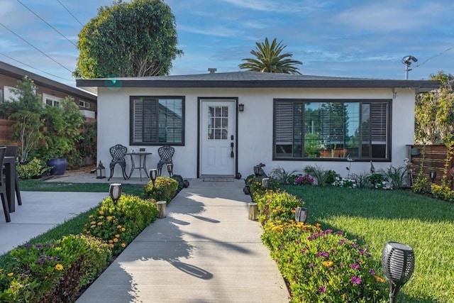 376378 Acacia Dr, Carlsbad, CA 92008 - bungalow-style house with stucco siding and a front lawn