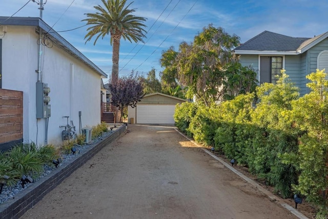376378 Acacia Dr, Carlsbad, CA 92008 - view of side of home with a garage, an outbuilding, and stairs