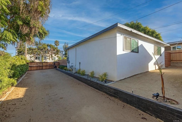 376378 Acacia Dr, Carlsbad, CA 92008 - view of side of property with stucco siding and a central air condition unit