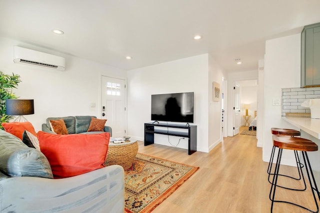 376378 Acacia Dr, Carlsbad, CA 92008 - living room featuring an AC wall unit, light wood-style flooring, and recessed lighting