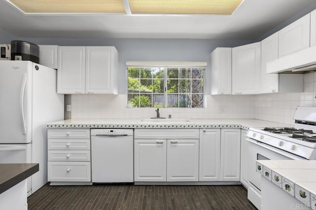 1001 Ontario St, Escondido, CA 92025 - kitchen with white appliances, white cabinets, tasteful backsplash, and light countertops