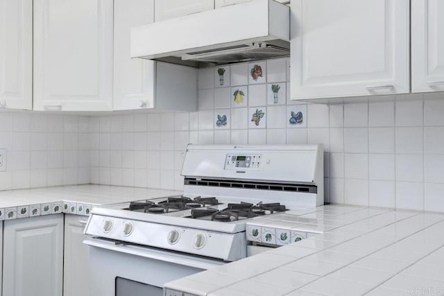 1001 Ontario St, Escondido, CA 92025 - kitchen with white gas range oven, ventilation hood, tasteful backsplash, and white cabinets