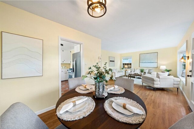 4920 Elsa Rd, San Diego, CA 92120 - dining room with baseboards and wood finished floors