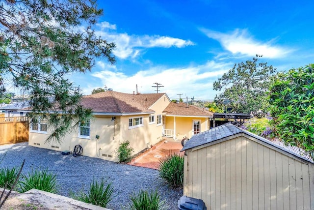 4920 Elsa Rd, San Diego, CA 92120 - back of house with stucco siding, a shingled roof, and crawl space