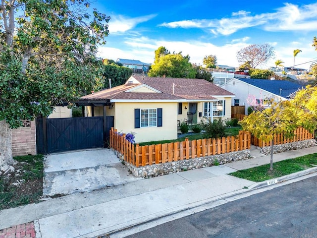 4920 Elsa Rd, San Diego, CA 92120 - bungalow-style home featuring a fenced front yard, a shingled roof, and stucco siding