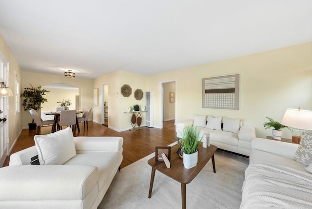 4920 Elsa Rd, San Diego, CA 92120 - living area with arched walkways and wood finished floors