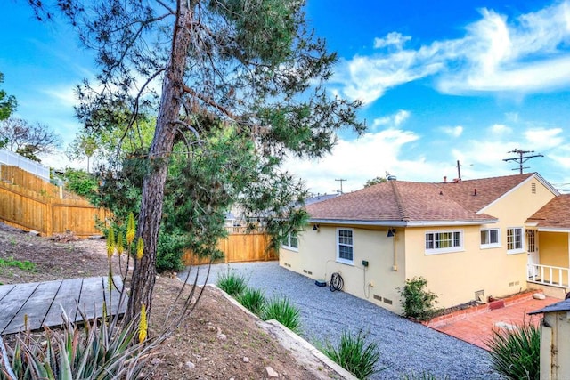 4920 Elsa Rd, San Diego, CA 92120 - rear view of property featuring stucco siding and roof with shingles